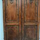 Double cupboard doors in carved oak, 20th century