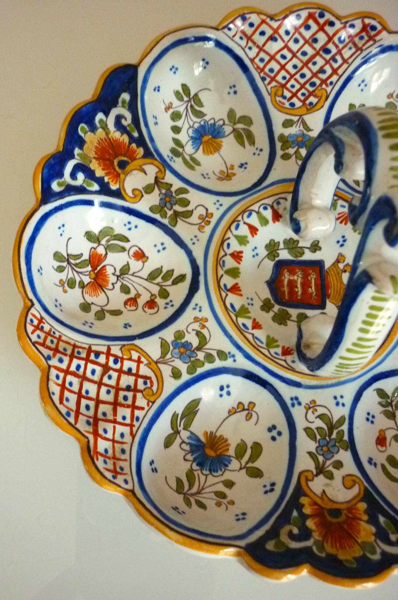 Dish, egg server in hand-painted earthenware, signed Geo Martel