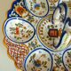Dish, egg server in hand-painted earthenware, signed Geo Martel