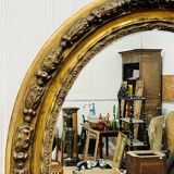Large golden oval mirror