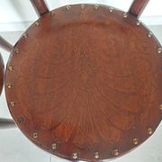 pair of round bistro chairs with a pattern on the seat, vintage
