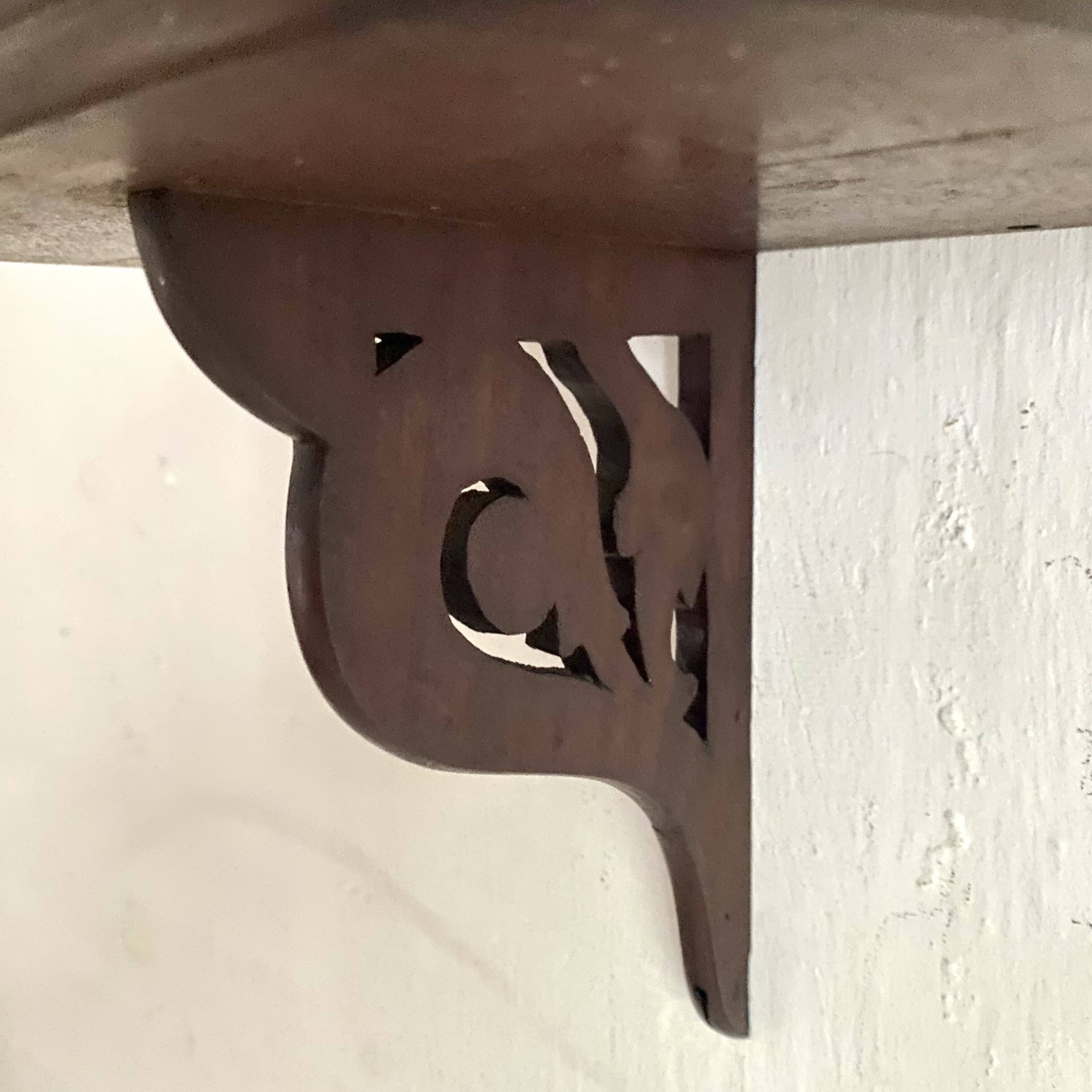 small old openwork wooden wall shelf