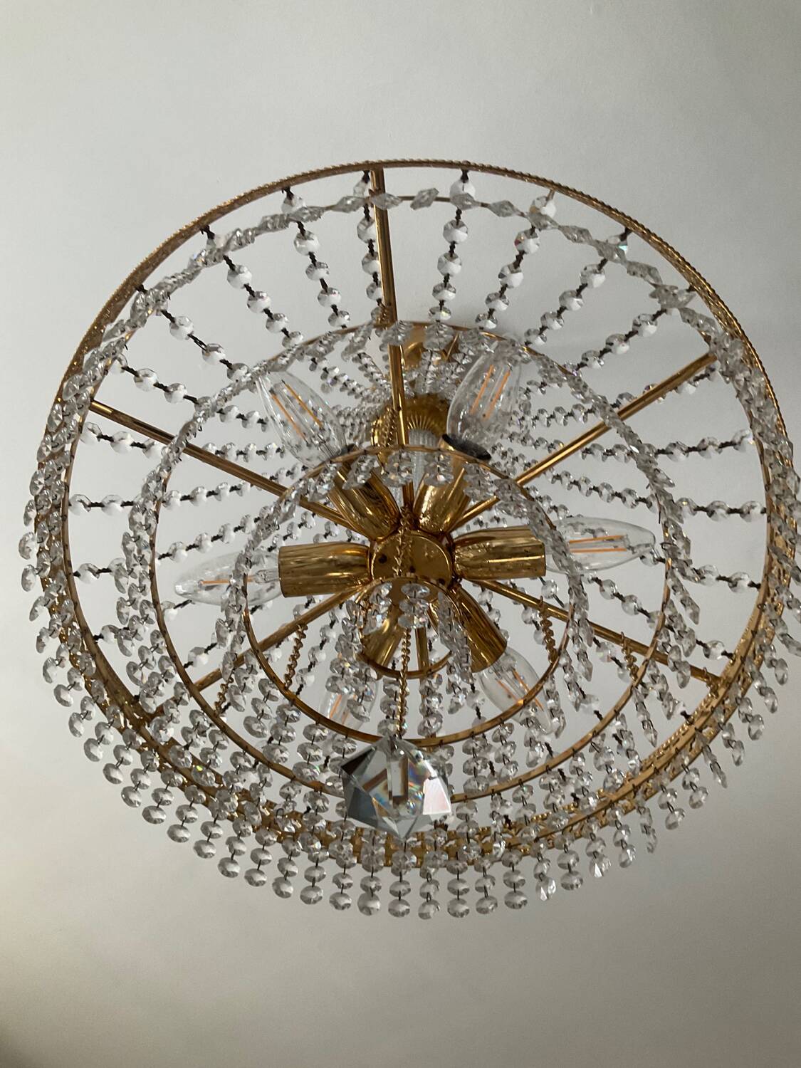 Brass hot air balloon chandelier with cascade of tassels
