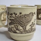 Set of four mugs in enamelled sandstone with bird decoration, made in england