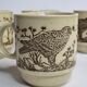 Ensemble de quatre mugs en grès émaillé à décor d'oiseau, made in england