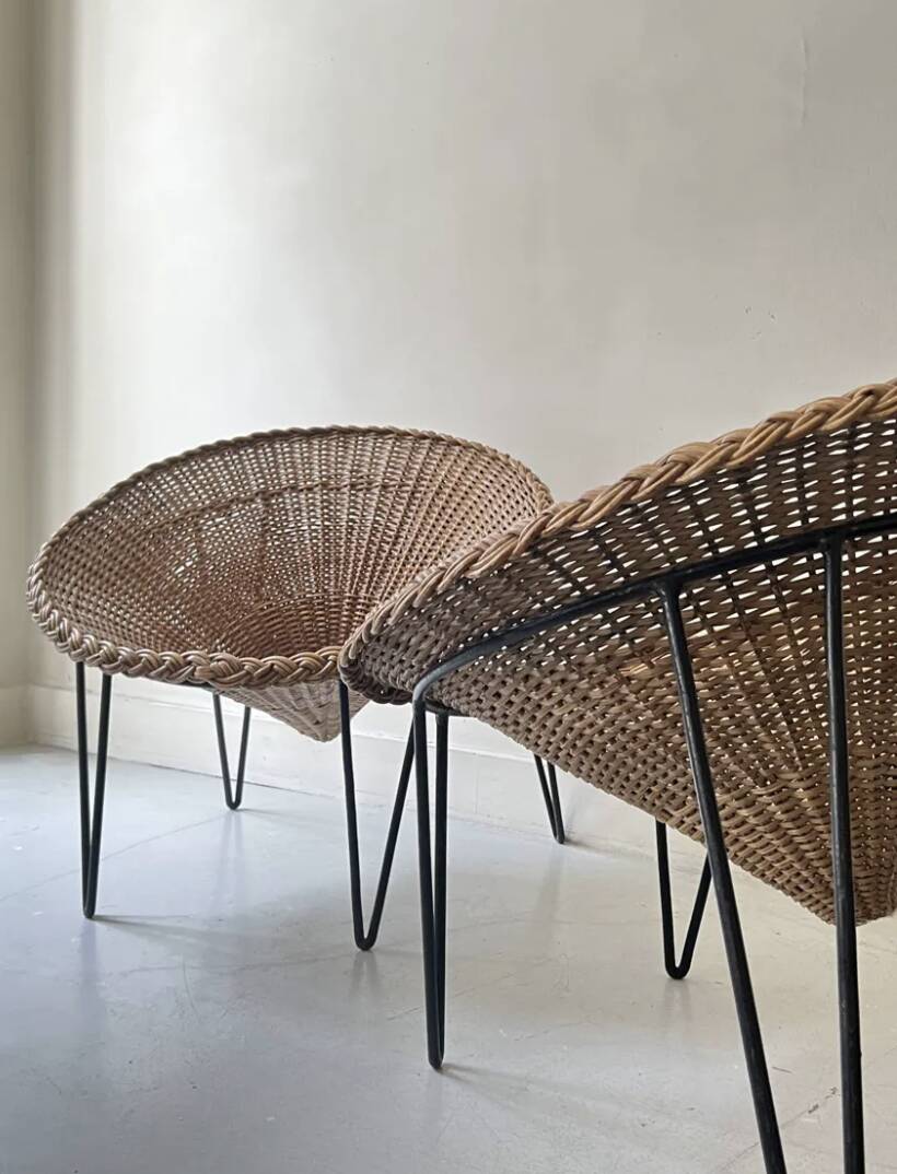 Italian basket chair in rattan and black metal, 1950s design.