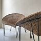 Italian basket chair in rattan and black metal, 1950s design.