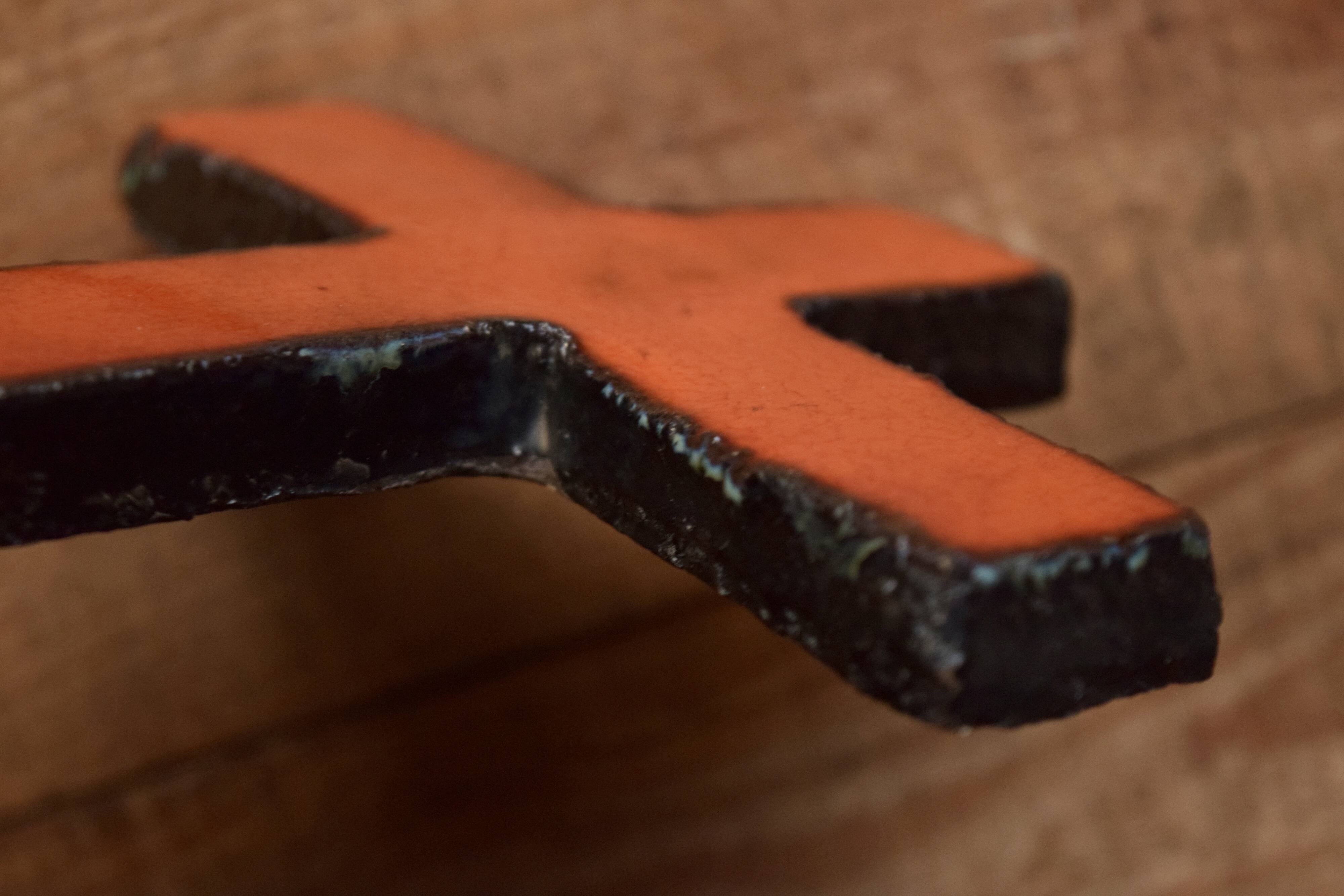 Orange glazed ceramic cross