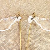 Gold wall light with tassel