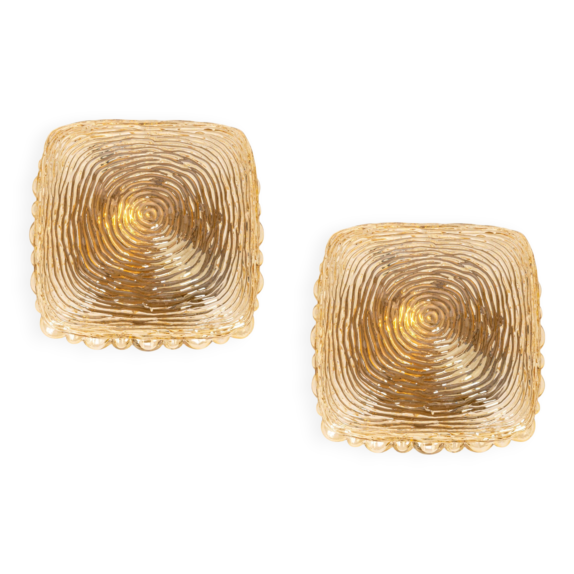 Pairs of amber glass wall lights in the shape of a fingerprint, Germany, 1970s.