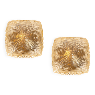 Pairs of amber glass wall lights in the shape of a fingerprint, Germany, 1970s.