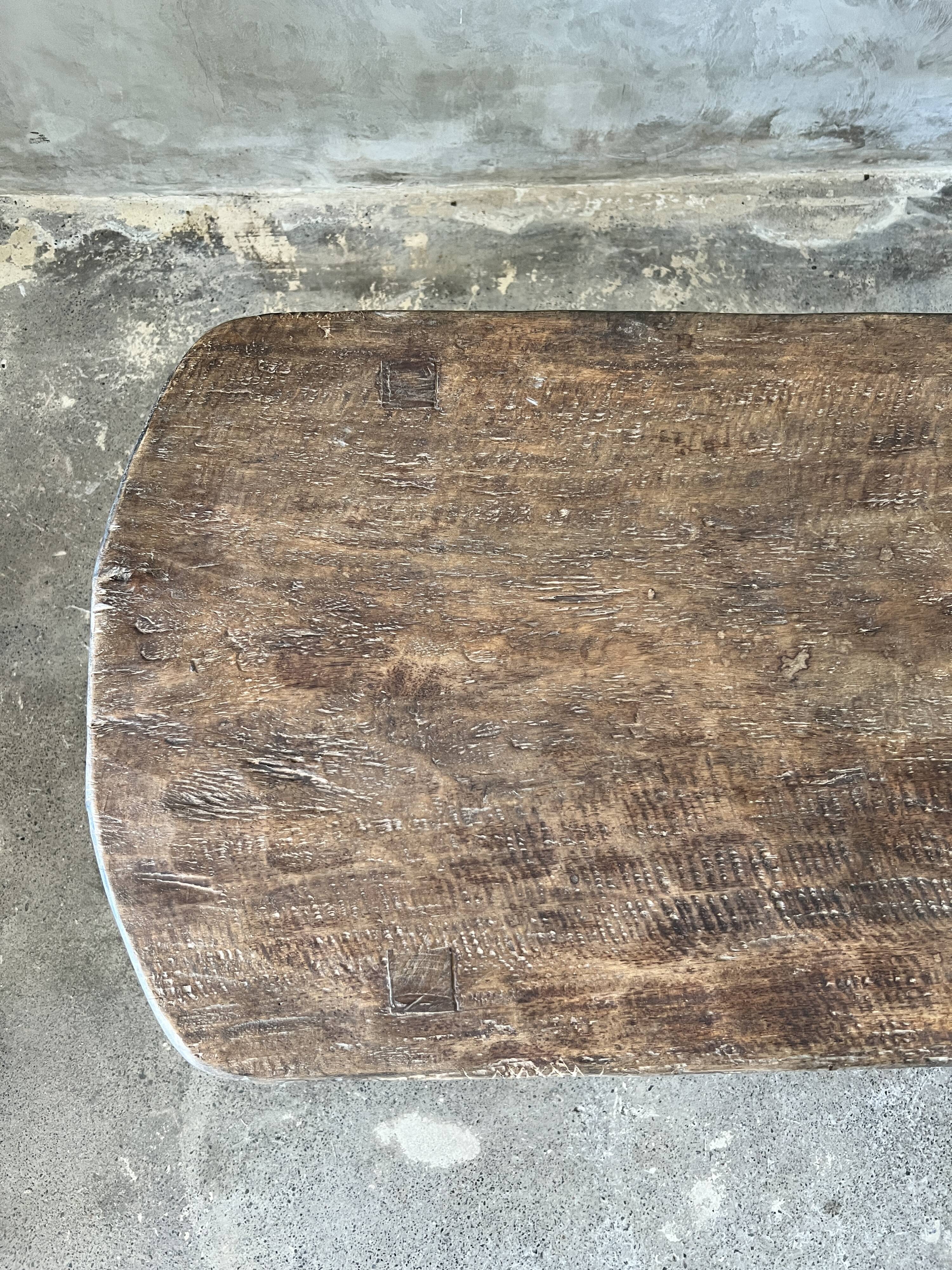 Large rounded coffee table in old Asian teak