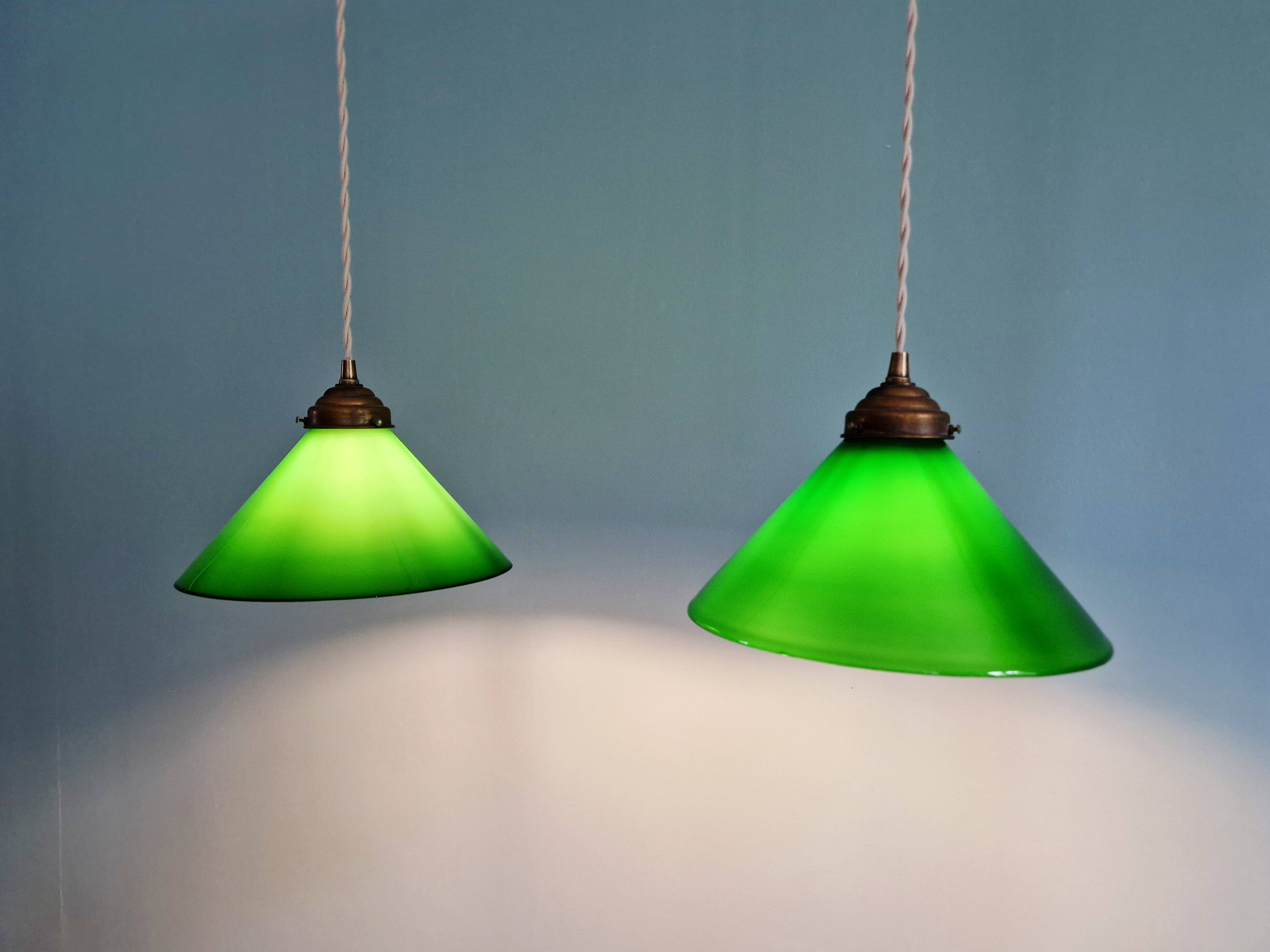 Pair of conical green opaline pendant lights, Art Deco style