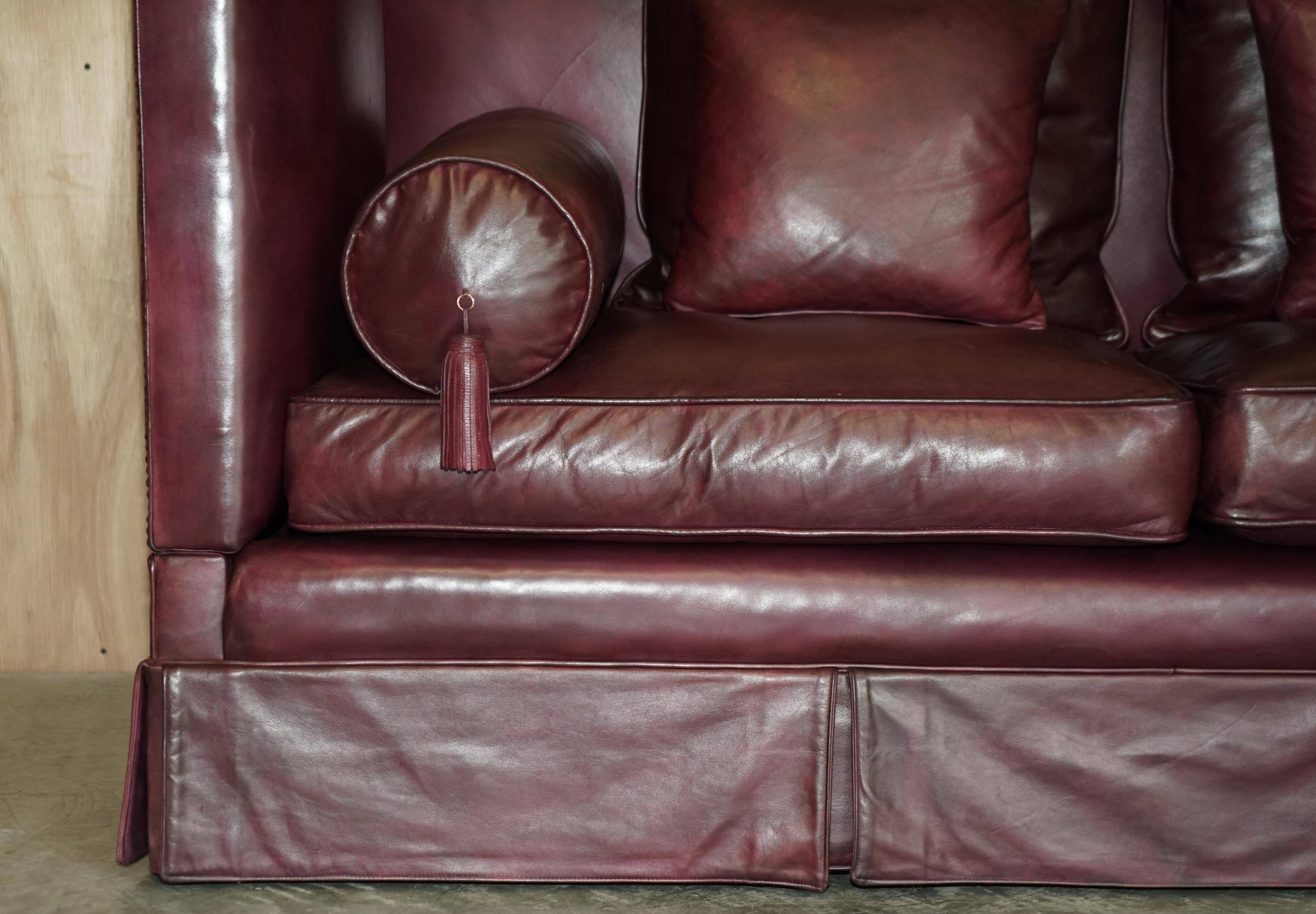 Victorian Knole canapé restored in leather with feather cushions.