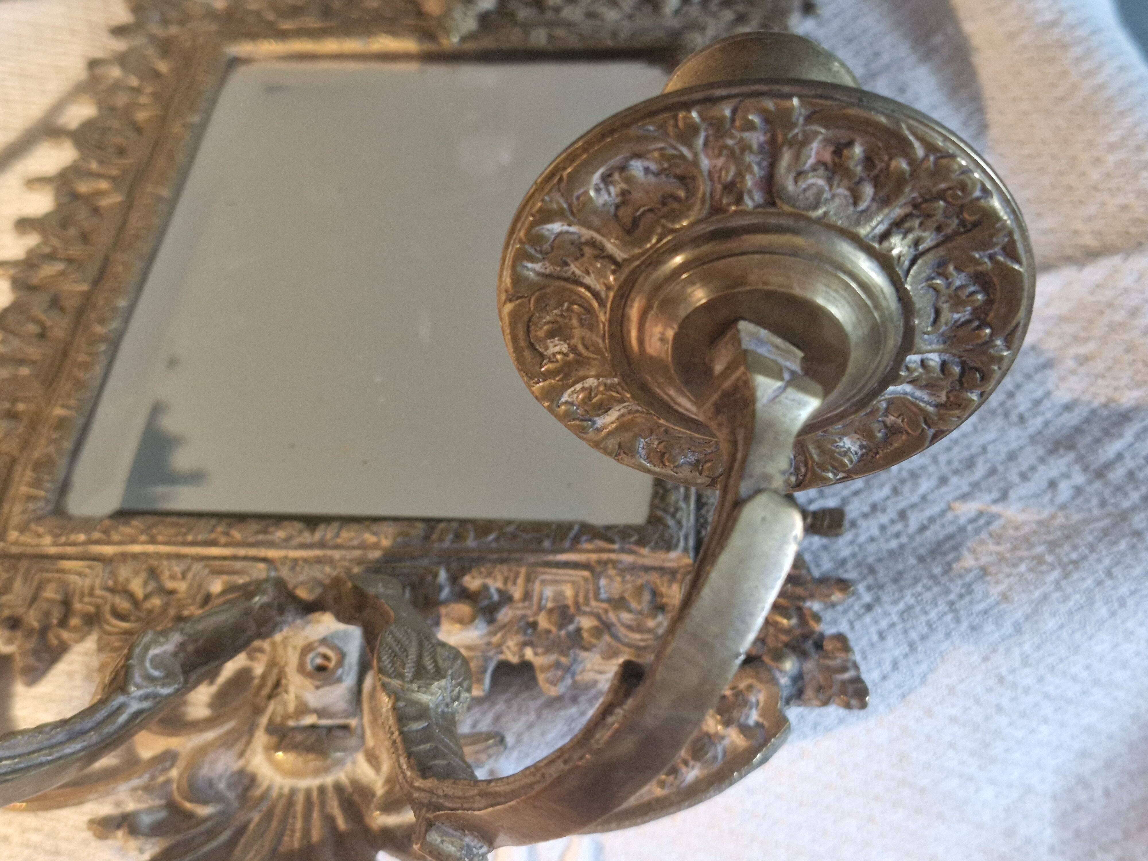 Pair of mirror sconces/candle holders in 19th-century bronze.