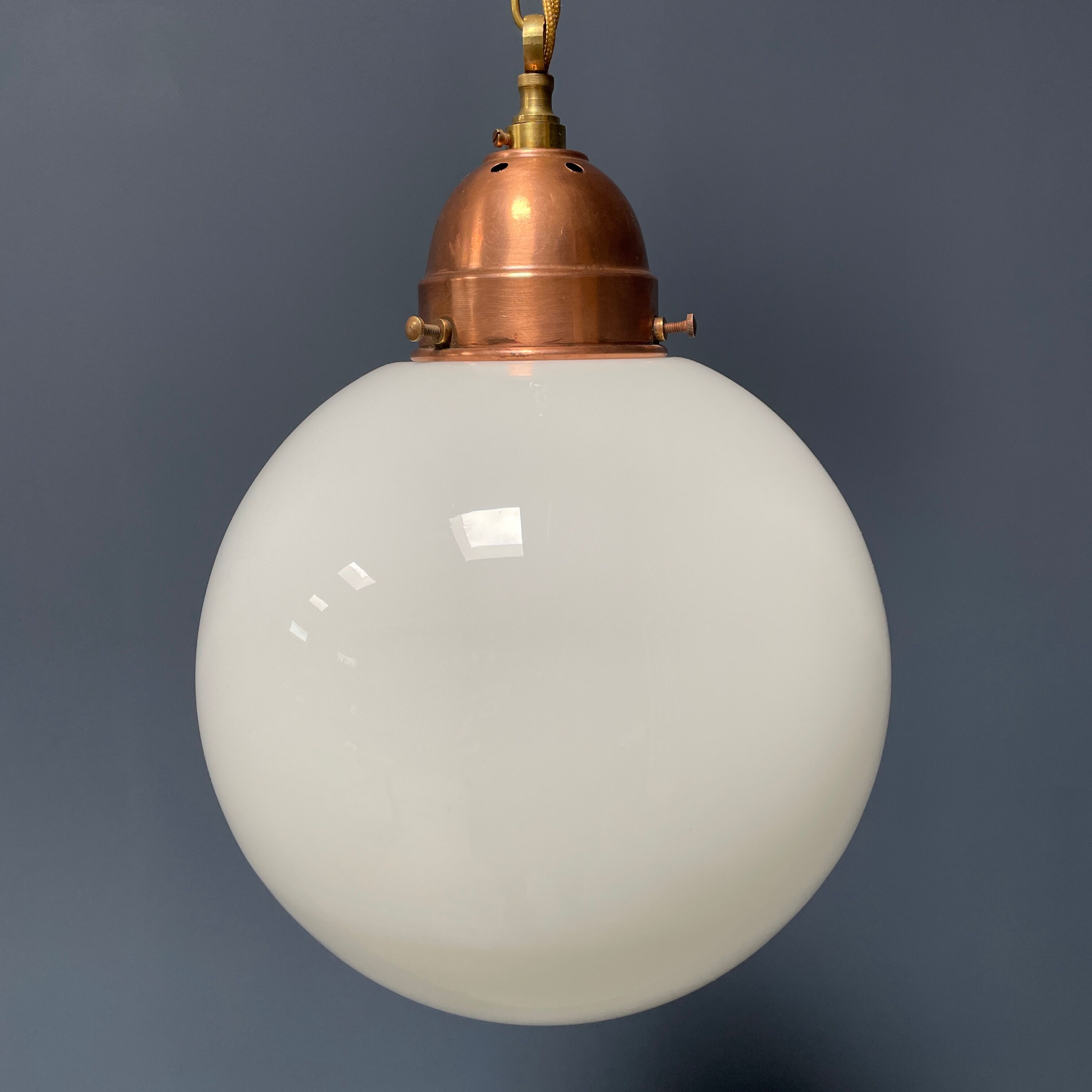 Opaline glass ball hanging lamp with copper fixture