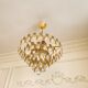 Vintage chandelier in gilded brass with crystal pendants.