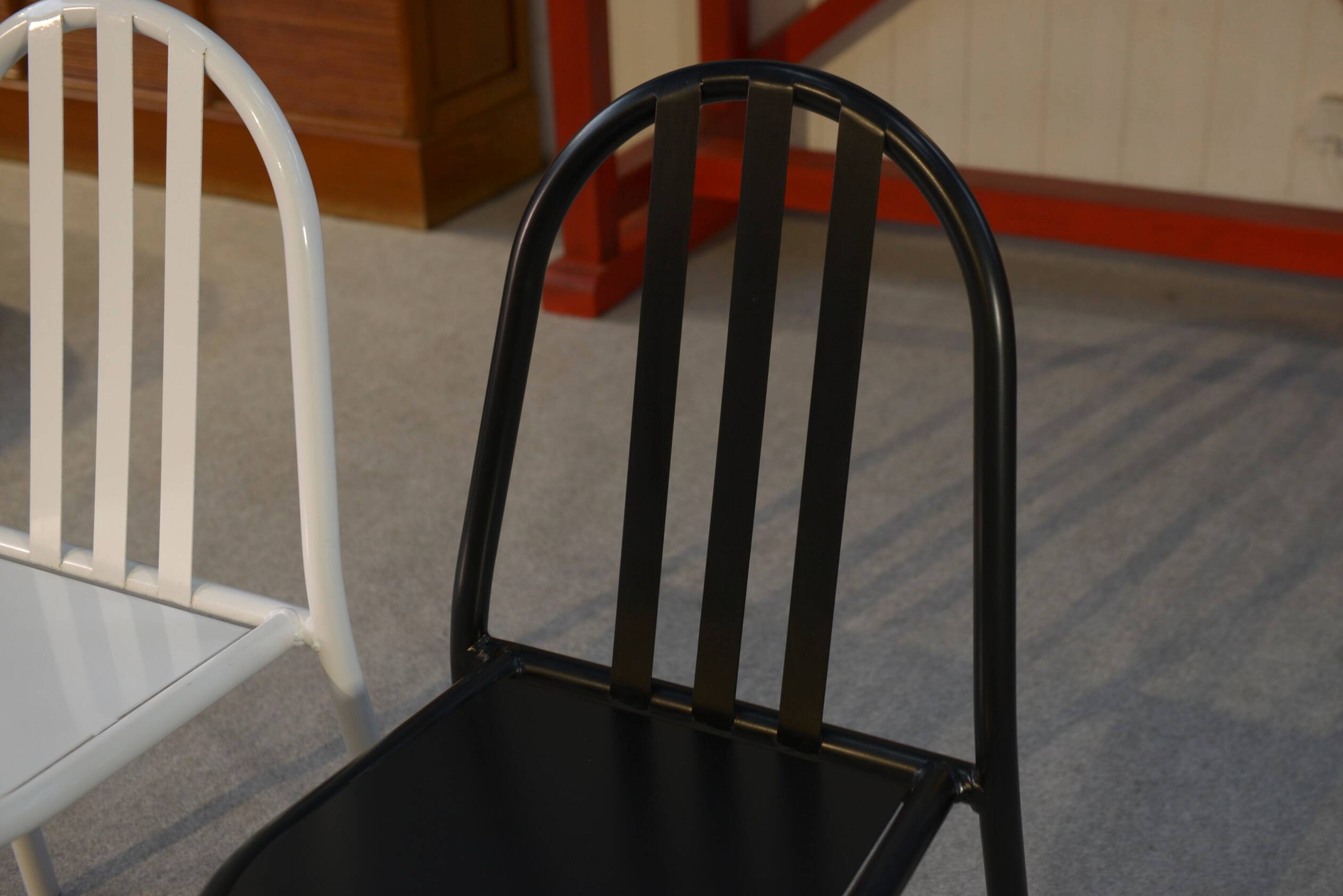 Pair of white and black chairs by Mallet Stevens