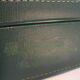 Dark green suitcase