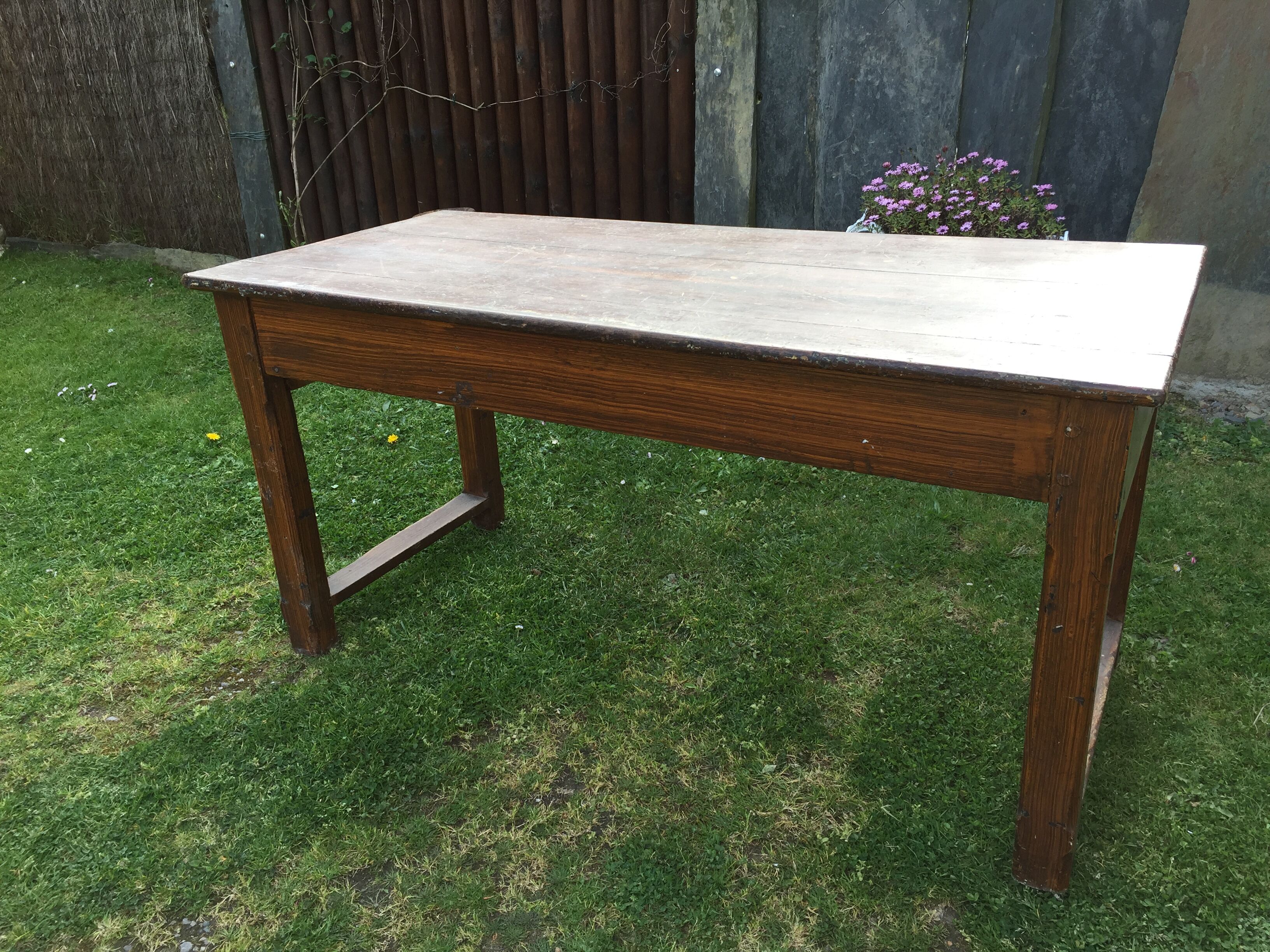 Old farmhouse table in oak painted faux wood old painting.