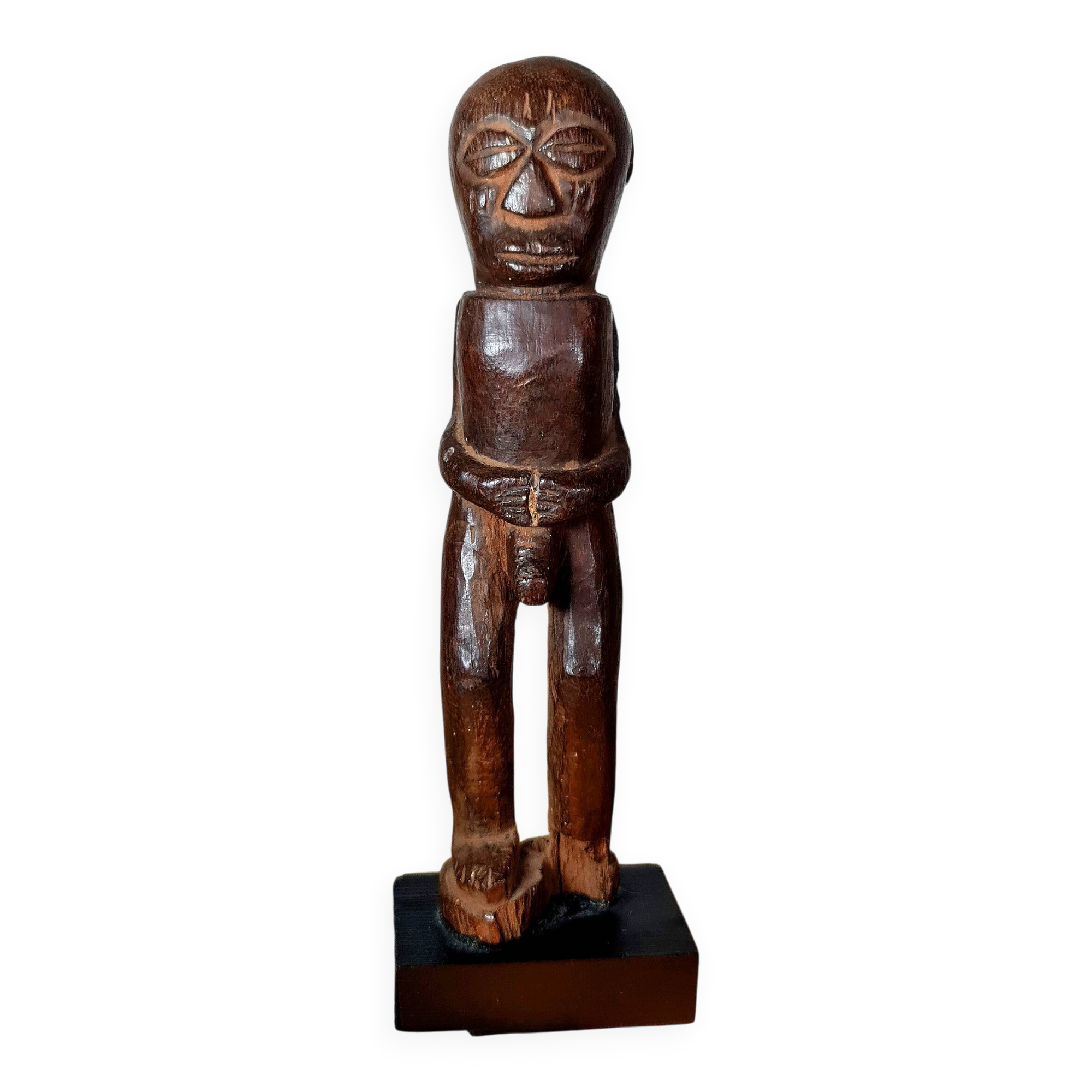 Old Fon statuette on a base, Benin