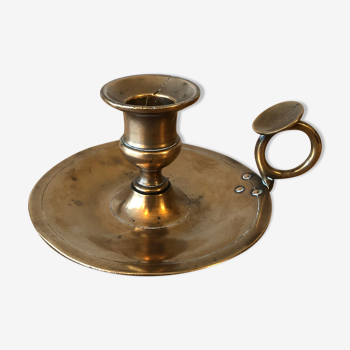Old copper hand-held candlestick