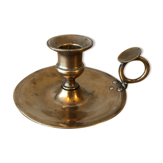 Old copper hand-held candlestick