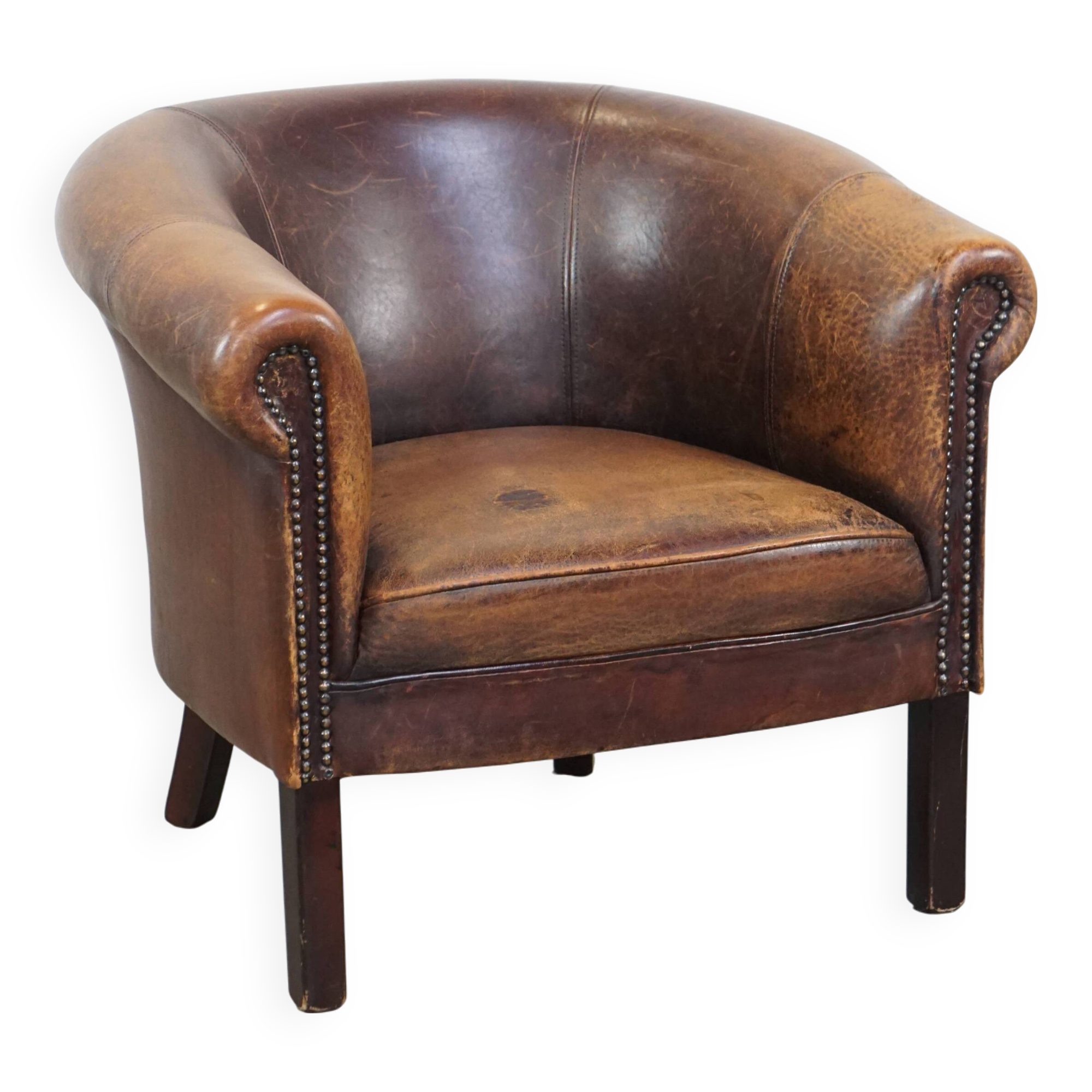 Sheep leather club chair finished with decorative nails