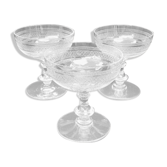 Three crystal champagne glasses engraved and chiseled