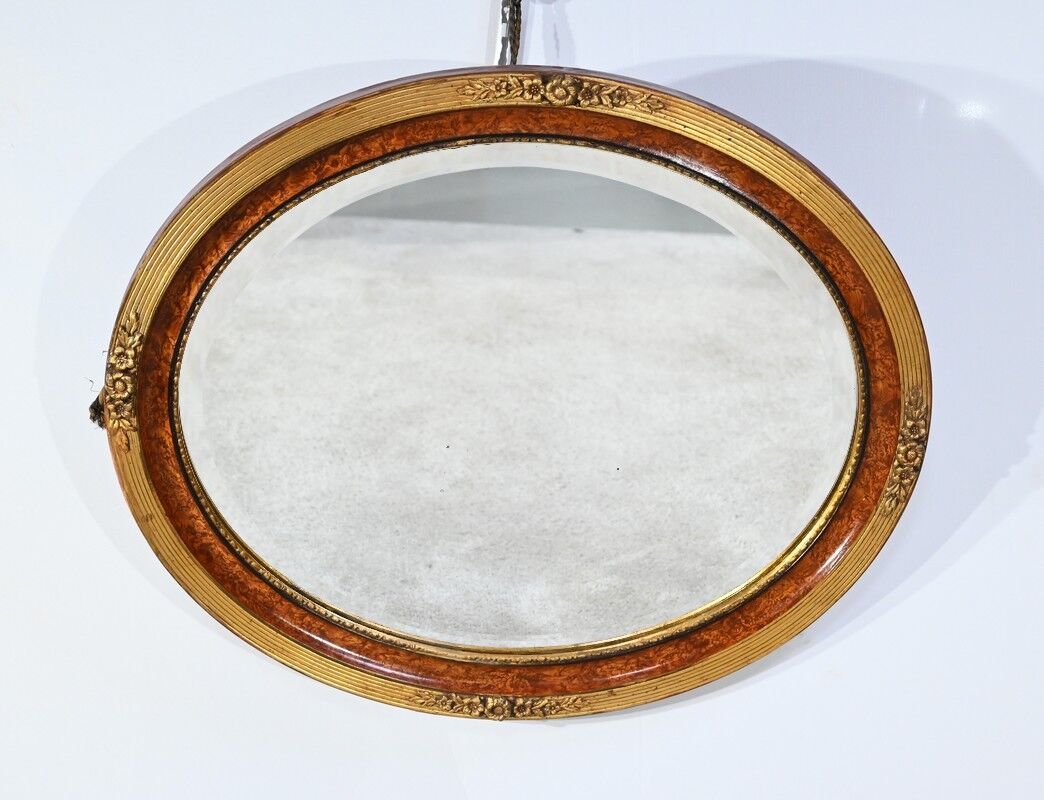 Oval mirror in gilded wood – early twentieth century