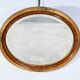 Miroir ovale en bois doré – début XXe