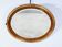 Oval mirror in gilded wood – early twentieth century