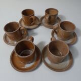 6 stoneware cups and saucers