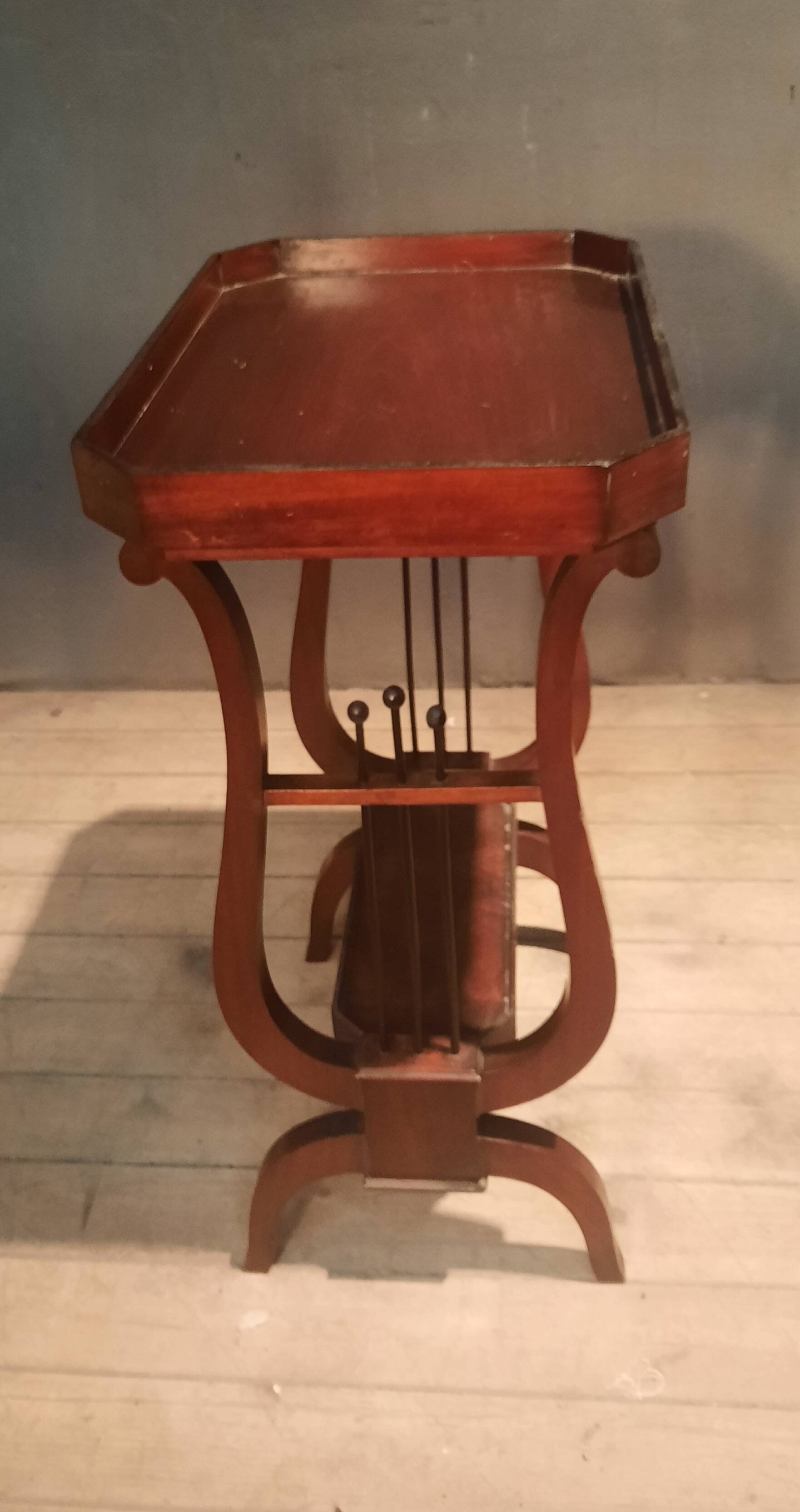 19th-century worker with a lyre footstool.