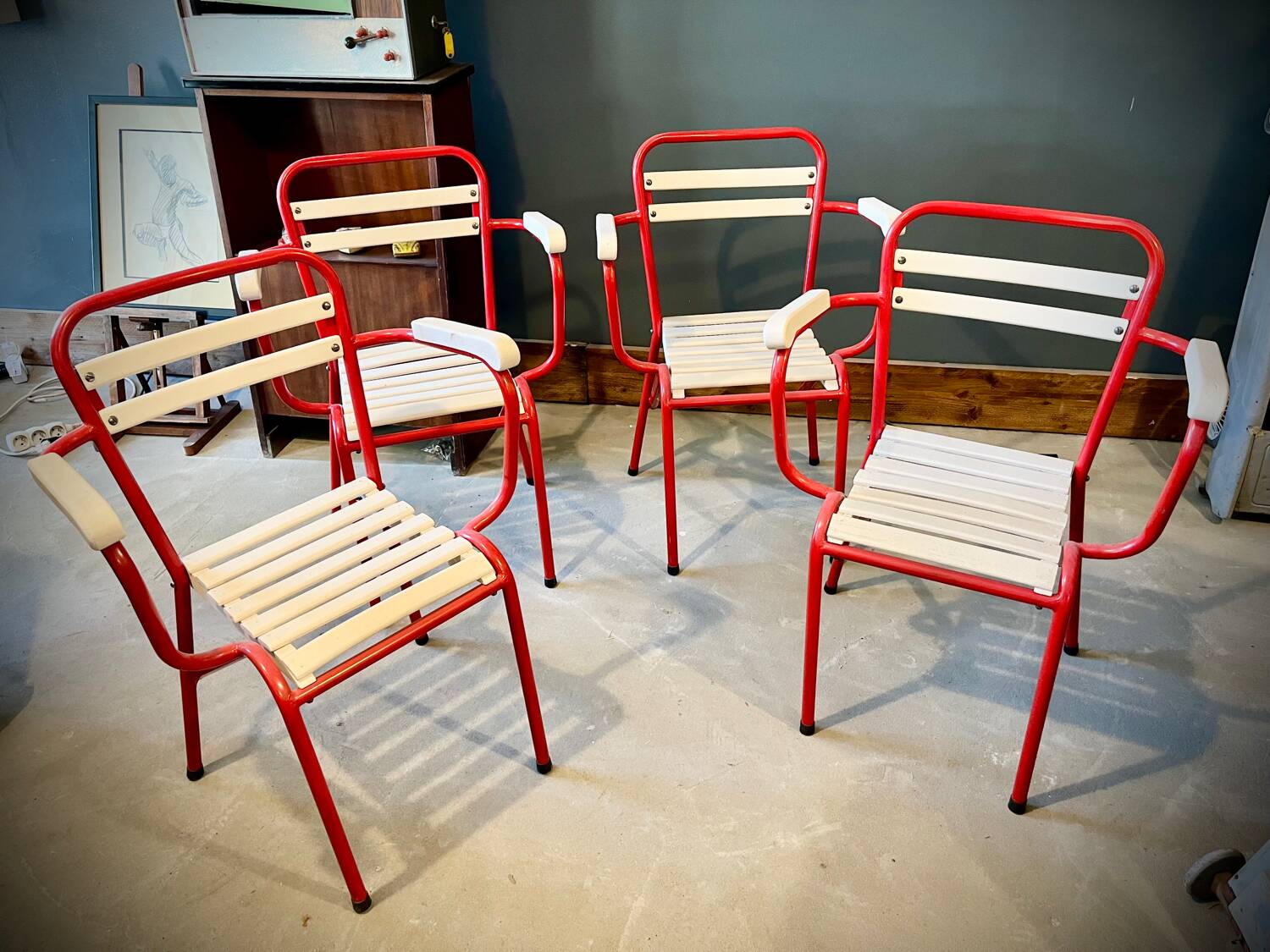 Four TOLIX chairs with armrests