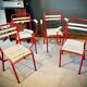 Four TOLIX chairs with armrests
