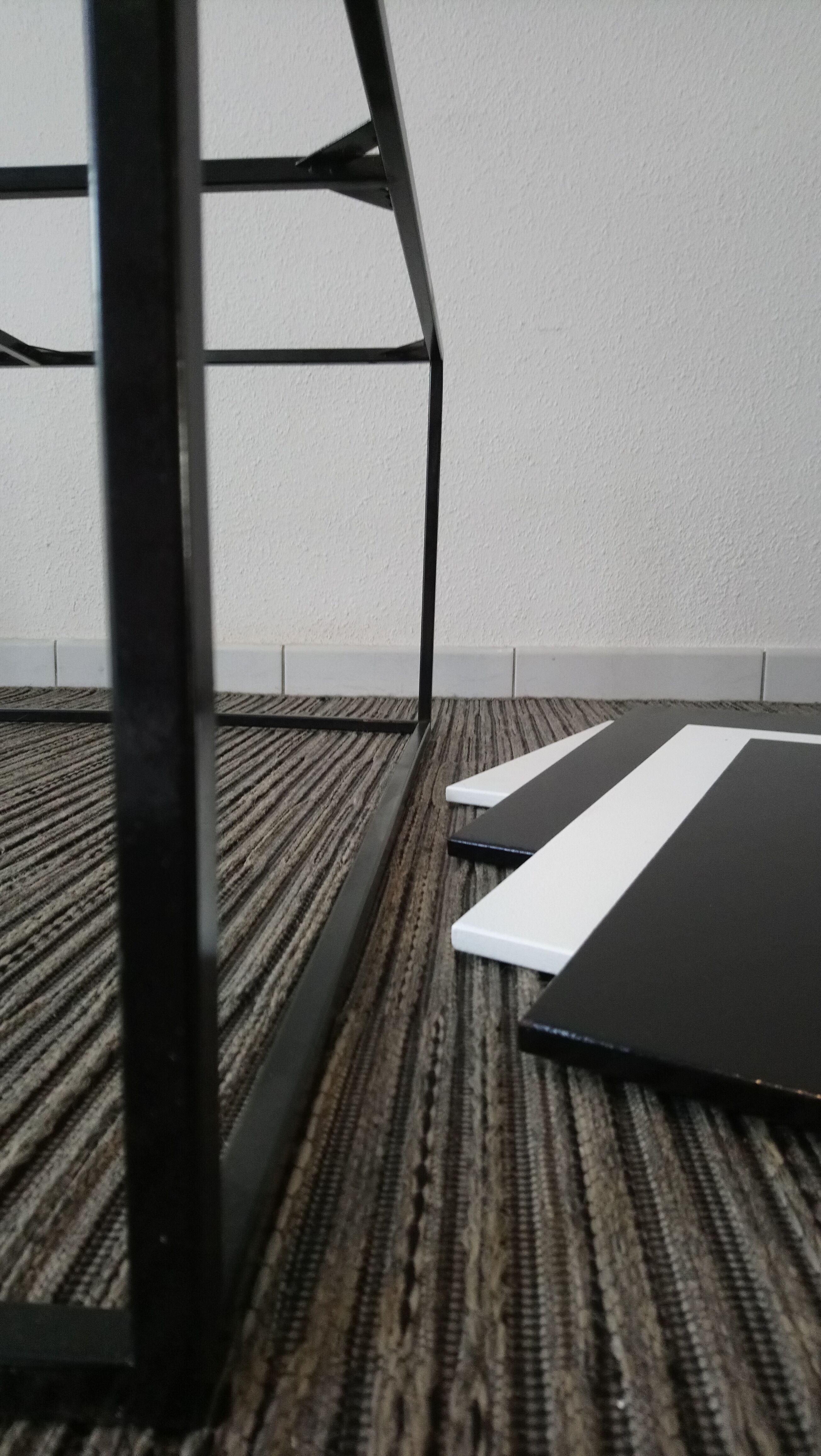 Square coffee table has checkered 80s