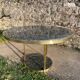 Round dining table with green marble and solid brass.