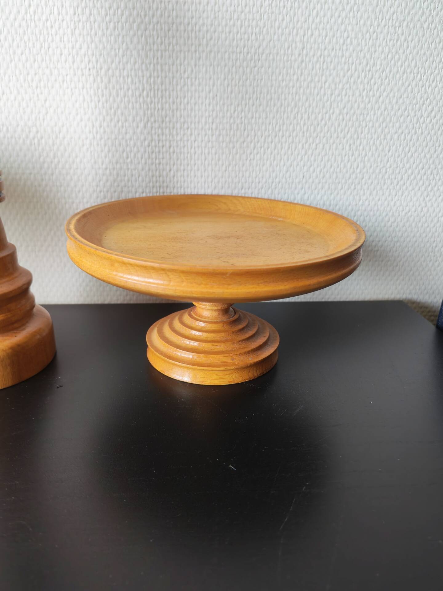 Vintage decor trio: candlestick and light wood bowls in Scandinavian style.