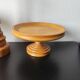 Vintage decor trio: candlestick and light wood bowls in Scandinavian style.