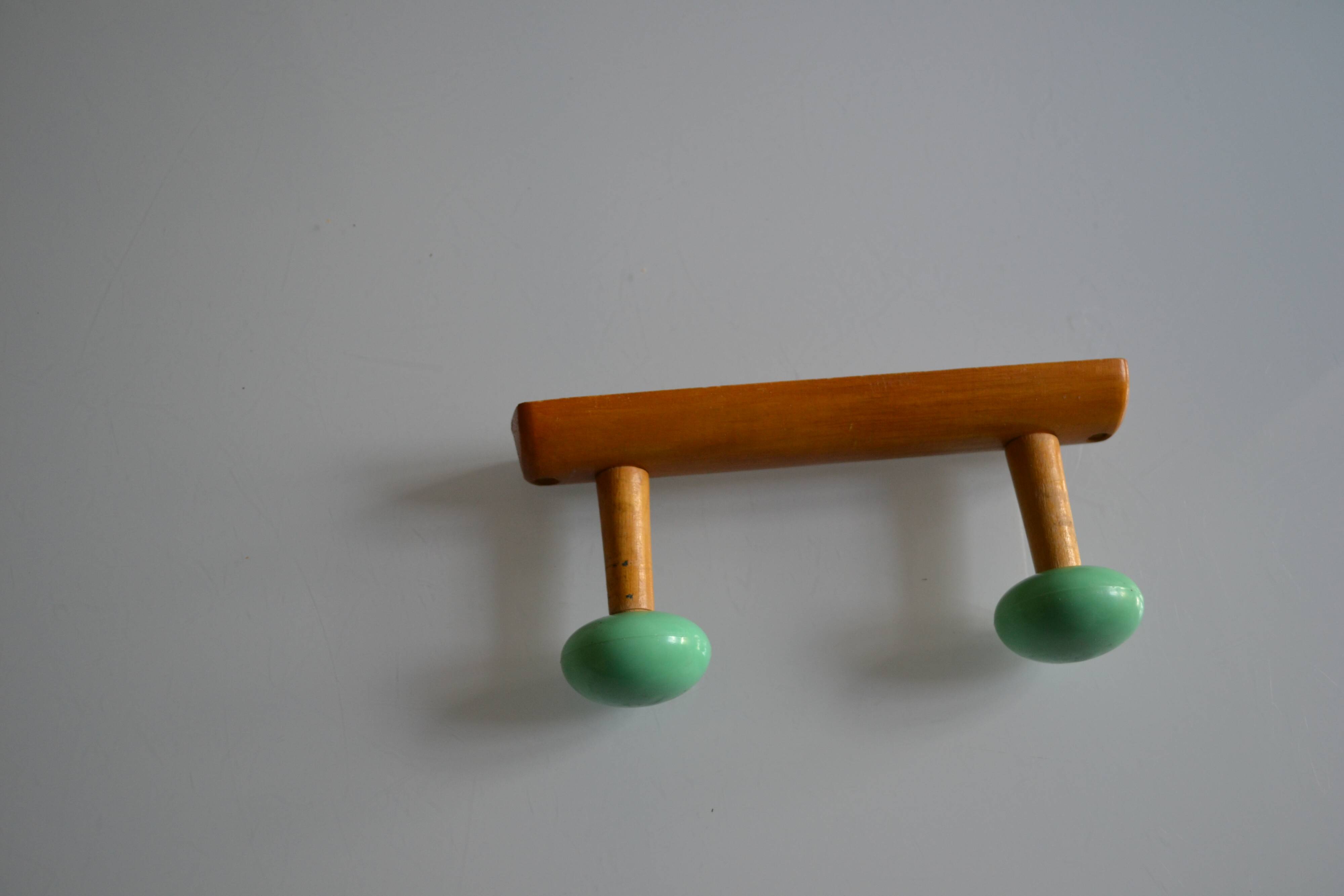 Wall coat rack with 2 hooks, wood and plastic, 60s style.