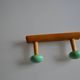 Wall coat rack with 2 hooks, wood and plastic, 60s style.