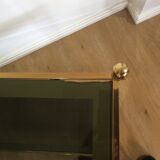 Three tier brass and glass console