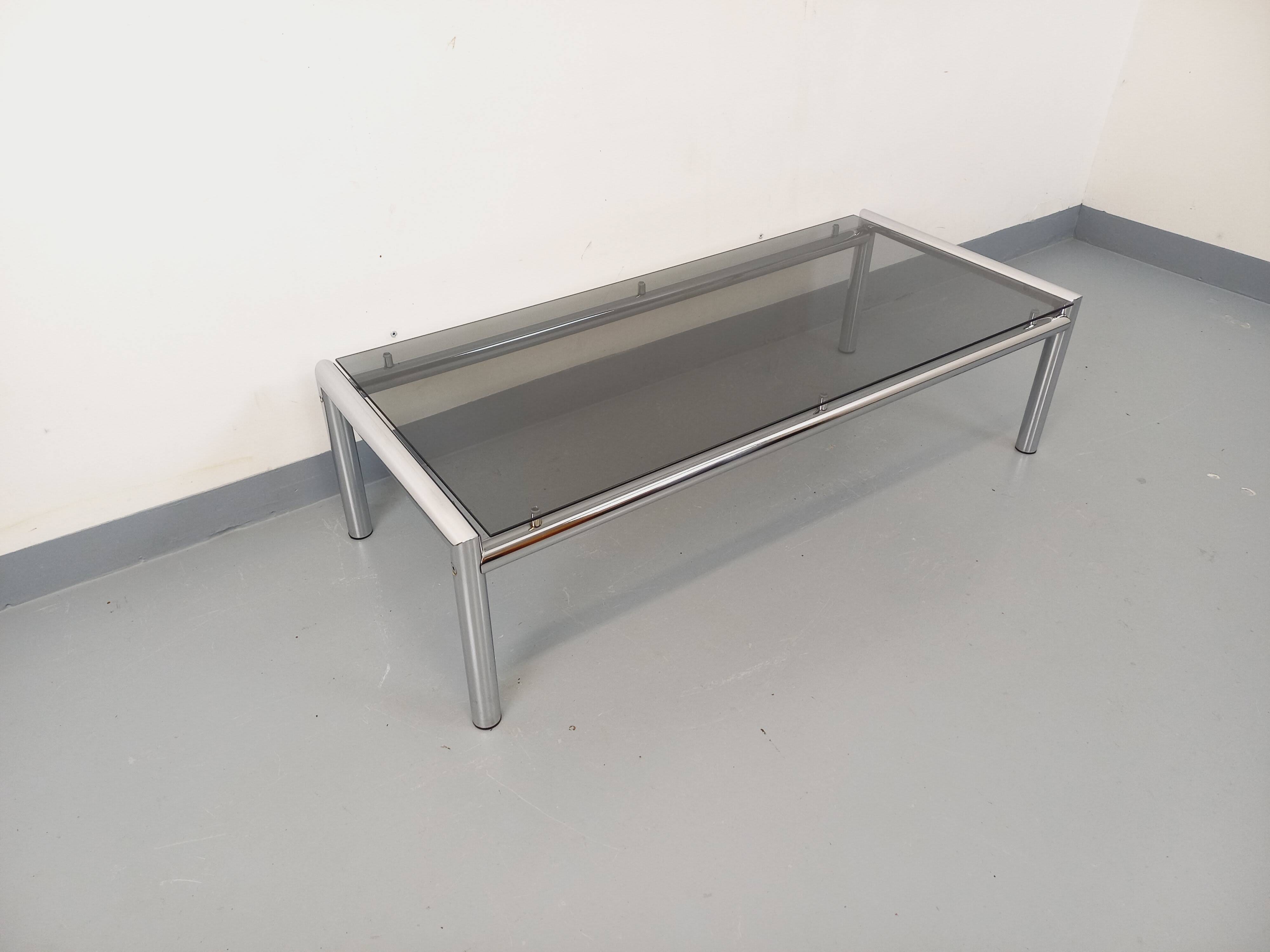 Vintage rectangular coffee table in smoked glass and chrome metal from the 1960s.