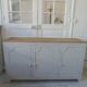Vintage low sideboard with 3 doors, pearl gray patina, wooden top.