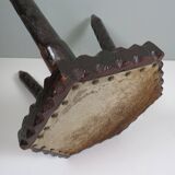 Vintage Spanish stool in carved wood with a leather seat.