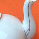 Old porcelain teapot with floral decoration