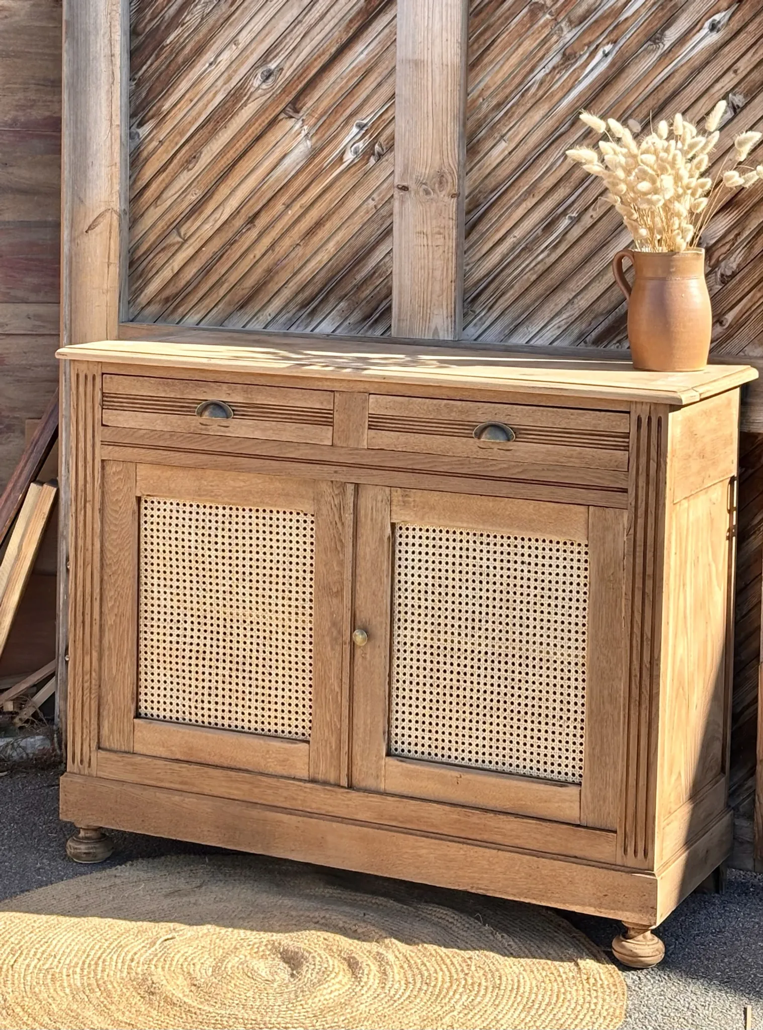 Old buffet in raw solid oak and cane.