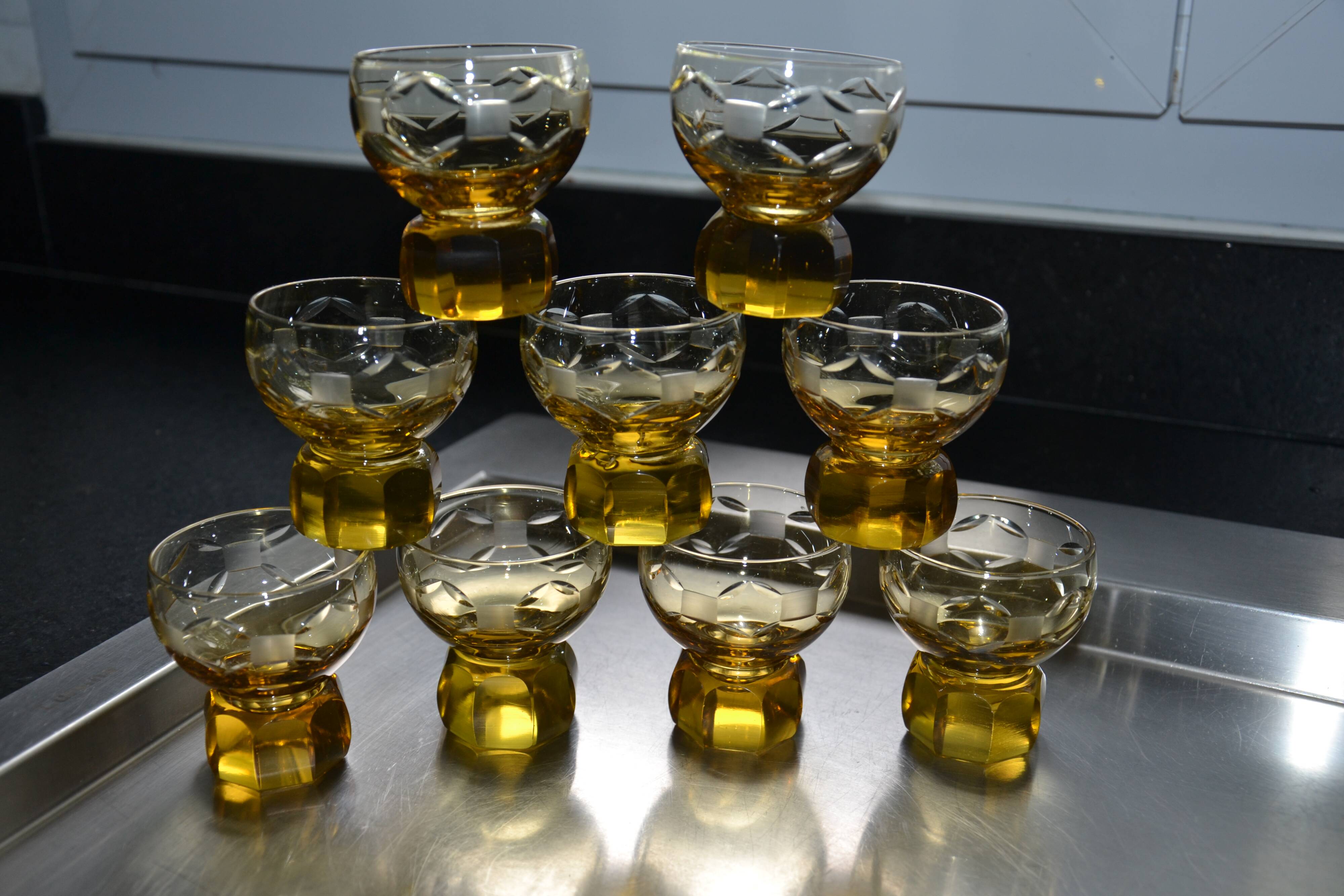 9 small amber art deco glasses