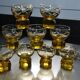 9 small amber art deco glasses